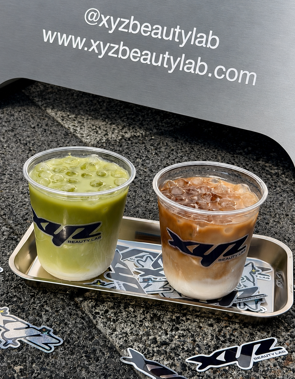 Complimentary iced matcha and iced coffee with XYZ Beauty Lab stickers.